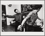 Baldwin dancing behind Doris Castle, arms raised