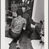 Baldwin dancing with Doris Castle, low to floor and appearing to do "the Twist"