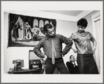 Baldwin dancing beside Doris Castle, hands on hips