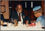 Baldwin seated with mother, Emma Berdis Jones Baldwin, at his 60th birthday celebration, UMass Campus Center