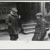 Townspeople of Woodstock, Vermont discussing the severe winter on the street corner in center of town