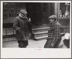 Townspeople of Woodstock, Vermont discussing the severe winter on the street corner in center of town