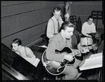 Gene Krupa with Horace Rollins, Ray Biondi, and Milton Raskin, rehearsing