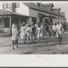 Day laborers who have just been paid off for hoeing cotton on the Hopson Plantation near Clarksdale, Mississippi Delta, Mississippi