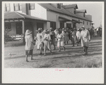 Day laborers who have just been paid off for hoeing cotton on the Hopson Plantation near Clarksdale, Mississippi Delta, Mississippi