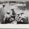 Parishoners peeling potatoes for a benefit picnic supper on the grounds of St. Thomas' Church. Near Bardstown, Kentucky