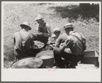 Parishoners peeling potatoes for a benefit picnic supper on the grounds of St. Thomas' Church. Near Bardstown, Kentucky