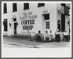 Townspeople visiting while sitting in front of Old Talbott Tavern on Saturday afternoon. Bardstown, Kentucky