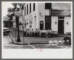 Townspeople visiting while sitting in front of Old Talbott Tavern on Saturday afternoon. Bardstown, Kentucky