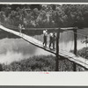 Carrying home groceries and supplies across the swinging bridge, Breathitt County, Jackson, Kentucky