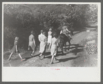 Relatives and friends of the family of the deceased going home from a memorial meeting in the mountains near Jackson, Kentucky. See general caption no. 1