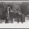 Woman using mounting block up Burton's Fork, Kentucky River, near Jackson, Kentucky