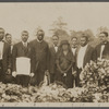 Photograph of funeral "Final earthly resting place of our friend, Bro. Bruce". Among those pictured are: Rev. Martin, Prof. W. W. Weeks, P. M. CE Cyril, Rev Wilson, Mrs. J. E. Bruce, A. Schomburg, and Marcus Garvey