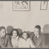Four children sitting on couch