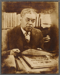 Portrait of Schomburg at his desk