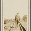 Schomburg standing on train tracks