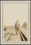 Schomburg standing on train tracks