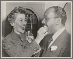 Fredi Washington Bell and Hugh Anthony Bell sharing wedding cake