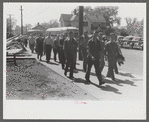 Workers entering plant at afternoon change of shift. Pratt and Whitney plant, United Aircraft, East Hartford, Connecticut