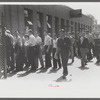 Workers entering plant at afternoon change of shift. Pratt and Whitney plant, United Aircraft, East Hartford, Connecticut