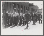 Workers entering plant at afternoon change of shift. Pratt and Whitney plant, United Aircraft, East Hartford, Connecticut