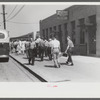 Workers entering plant at afternoon change of shift. Pratt and Whitney plant, United Aircraft, East Hartford, Connecticut