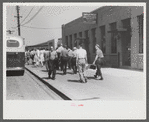 Workers entering plant at afternoon change of shift. Pratt and Whitney plant, United Aircraft, East Hartford, Connecticut