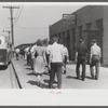 Workers entering plant at afternoon change of shift. Pratt and Whitney plant, United Aircraft, East Hartford, Connecticut