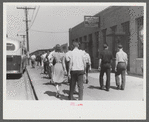 Workers entering plant at afternoon change of shift. Pratt and Whitney plant, United Aircraft, East Hartford, Connecticut