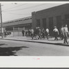 Workers entering plant at afternoon change of shift. Pratt and Whitney plant, United Aircraft, East Hartford, Connecticut