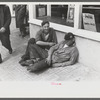 Workers lounging around town and waiting for a lift home at afternoon change of shift of Electric Boat Works, Groton, Connecticut