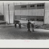 Workers entering plant at afternoon change of shift. Electric Boat Works, Groton, Connecticut