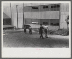 Workers entering plant at afternoon change of shift. Electric Boat Works, Groton, Connecticut