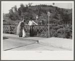 Mountain woman chatting with a friend on the bridge in Jackson, Breathitt County, Kentucky