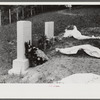 New graves decorated for an annual memorial meeting. In the mountains near Jackson, Kentucky. See general caption no. 1