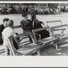 Yanceyville, North Carolina. Spectators listening to the county school superintendent speaking at the Caswell County Fair