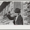 Noah Garland sitting on the steps of his son's home, Southern Appalachian Project, near Barbourville, Knox County, Kentucky