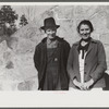 Mr. and Mrs. S. Castle or Mr. and Mrs. William S. Allen standing before their new storage house. Southern Appalachian Project, near Barbourville, Knox County, Kentucky