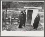 Dr. R.B. Fulks, county health officer, John E. Hale, contractor and builder of sanitary units, and B.H. Pitt, inspector of sanitary units, making a sanitation inspection on the farm of Hobert Hammons, FSA (Farm Security Administration) borrower