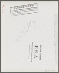 Spanish trapper looking at receipt which FSA (Farm Security Administration) supervisor has just given him for making payment on his loan. He has just sold a "lot" of muskrats at auction sale held in dancehall on Delacroix Island, Louisiana