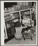 Children buying groceries in co-op store. Greenbelt, Maryland