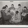 Housewives in Tygart Valley, West Virginia, have weekly group meetings in home economics. Here they are quilting