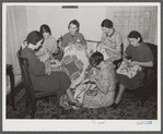Housewives in Tygart Valley, West Virginia, have weekly group meetings in home economics. Here they are quilting