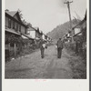 Coal miners going home. Company houses, Capels, West Virginia