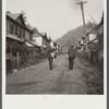 Coal miners going home. Company houses, Capels, West Virginia