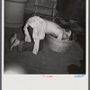 Miner takes washtub bath as most the families do. Westover, West Virginia