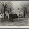 Rear view of home being remodeled for rehabilitation client, showing new addition on left. Near Raleigh, North Carolina