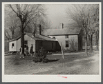 Rear view of home being remodeled for rehabilitation client, showing new addition on left. Near Raleigh, North Carolina
