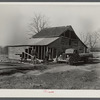 Barn being remodeled on farm purchased for rehabilitation client near Raleigh, North Carolina (county supervisor at right)