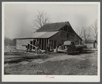 Barn being remodeled on farm purchased for rehabilitation client near Raleigh, North Carolina (county supervisor at right)